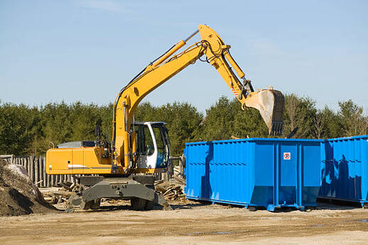 Two blue dumpster rentals at a demolition site in Norwalk, CT.