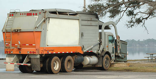 A dumpster truck at a Norwalk, CT park.